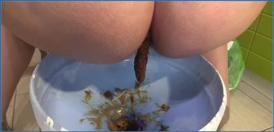 Scatting with MilanaSmelly as she uses a feeding tool in a vomit-filled femdom video